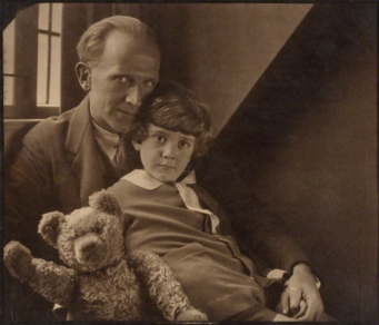 Milne with his son Christopher Robin and Pooh Bear, at Cotchford Farm, their home in Sussex. Photo by Howard Coster, 1926. (via Wikipedia)